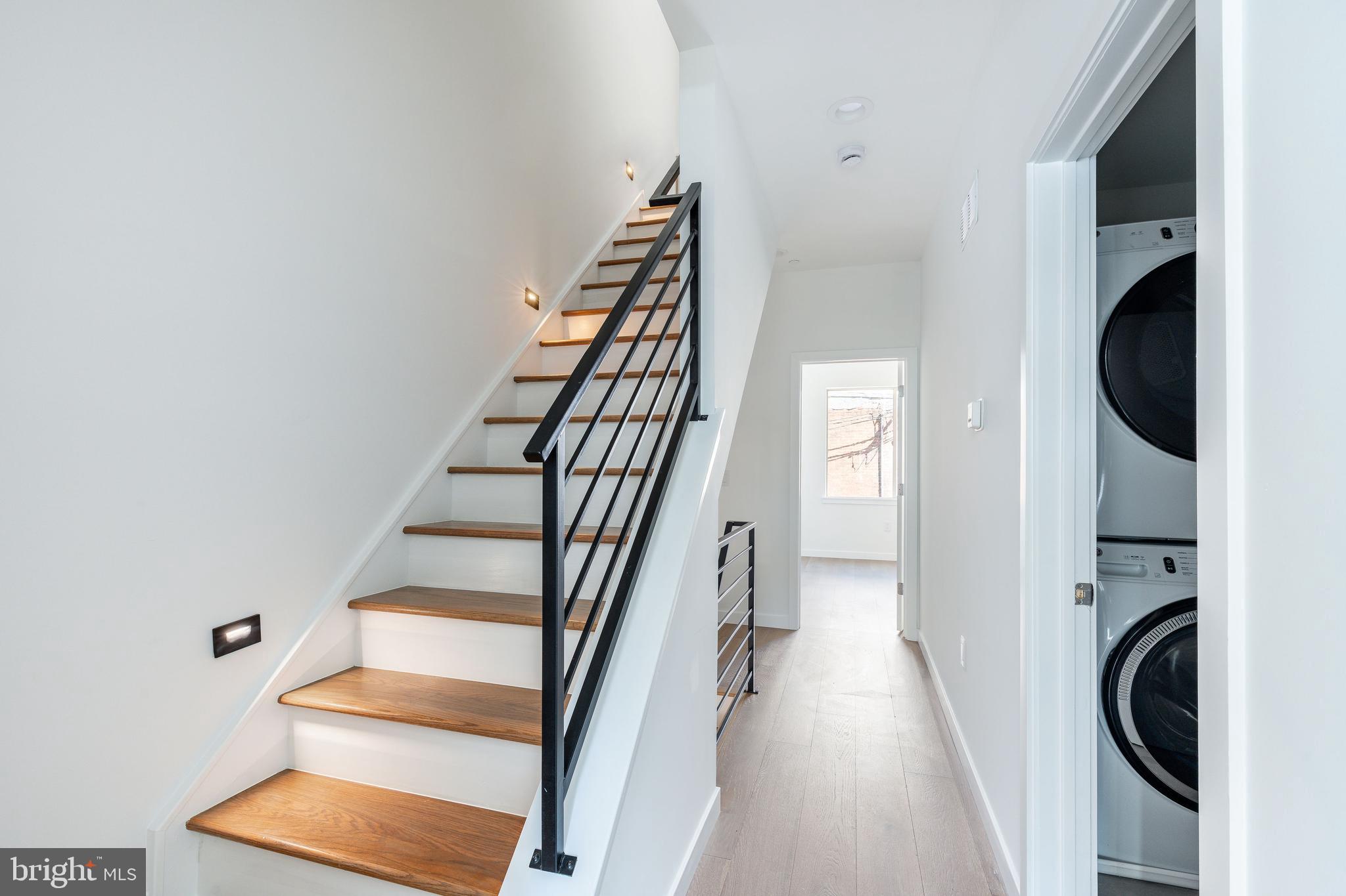 2925 Master Street Philadelphia, PA 19121 - Photo 30 of 41 a view of a hallway with wooden floor and entryway