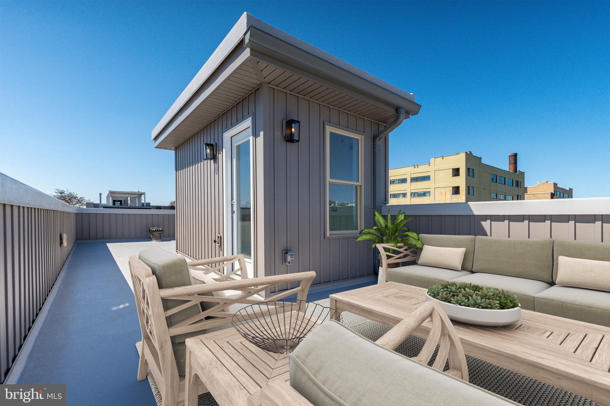2925 Master Street Philadelphia, PA 19121 - Photo 33 of 41 a view of a patio with couches table and chairs and potted plants