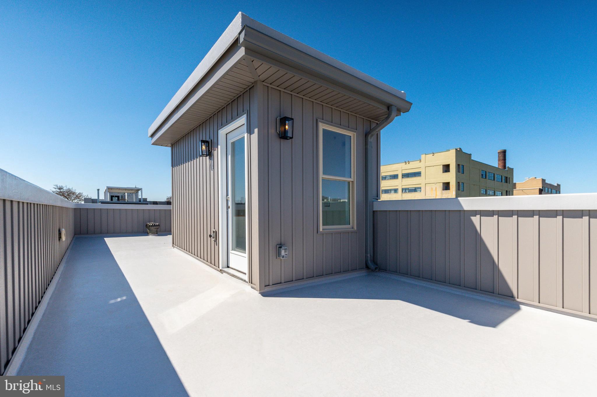 2925 Master Street Philadelphia, PA 19121 - Photo 34 of 41 a view of a house with a wooden deck