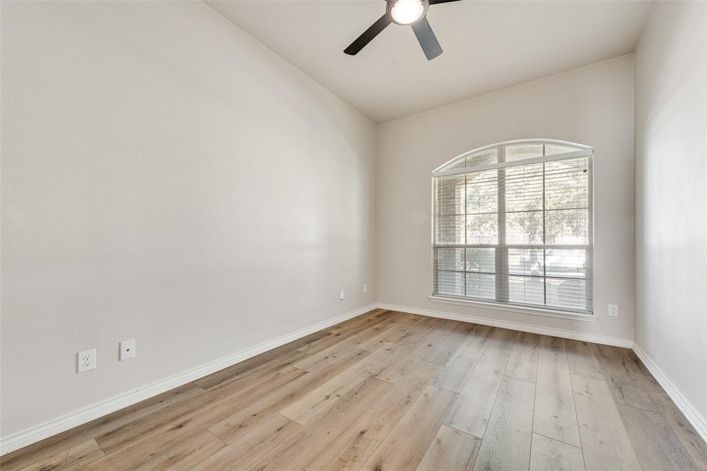 103 Rambling Way Forney, TX 75126 - Photo 26 of 32 an empty room with wooden floor and windows