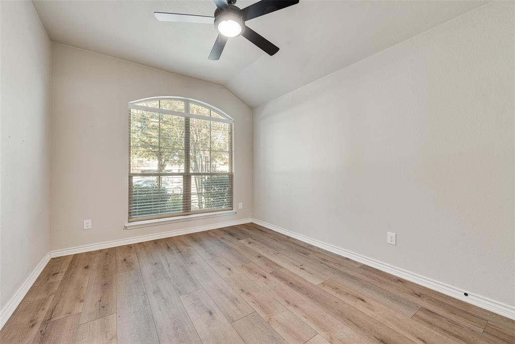 103 Rambling Way Forney, TX 75126 - Photo 28 of 32 an empty room with wooden floor fan and windows