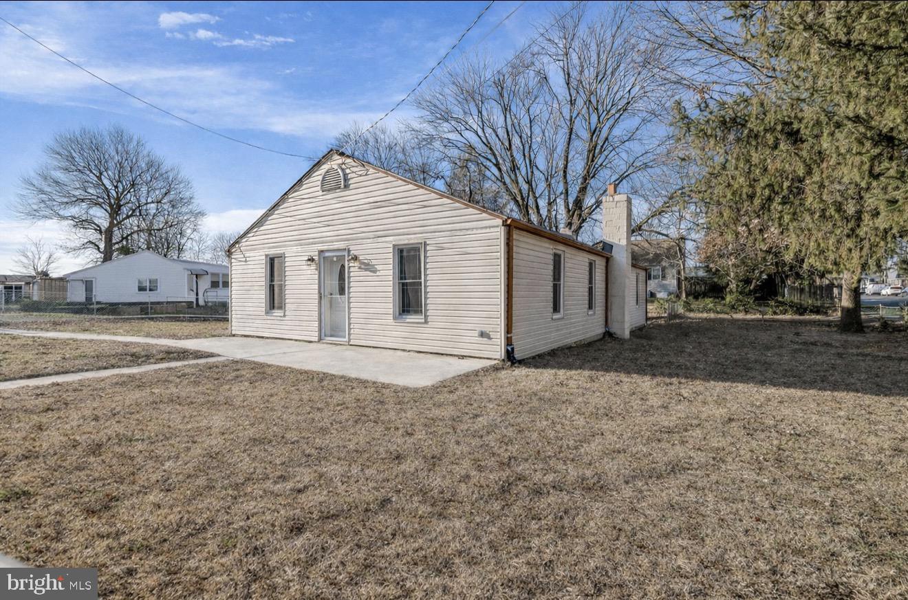 7748 Overhill Road Glen Burnie, MD 21060 - Photo 1 of 1 a view of a white house with a yard