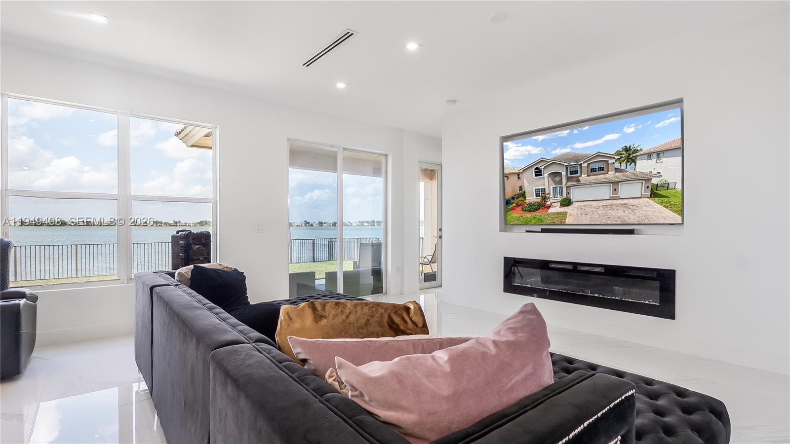 17739 Southwest 54th Street Miramar, FL 33029 - Photo 16 of 47 a living room with furniture fireplace and a large window