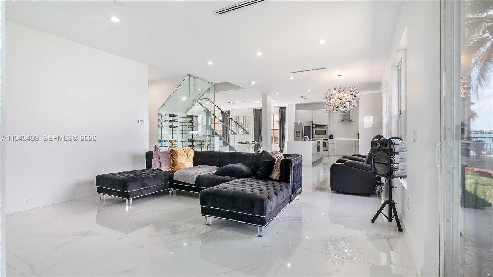 17739 Southwest 54th Street Miramar, FL 33029 - Photo 18 of 47 a living room with furniture and a gym machine