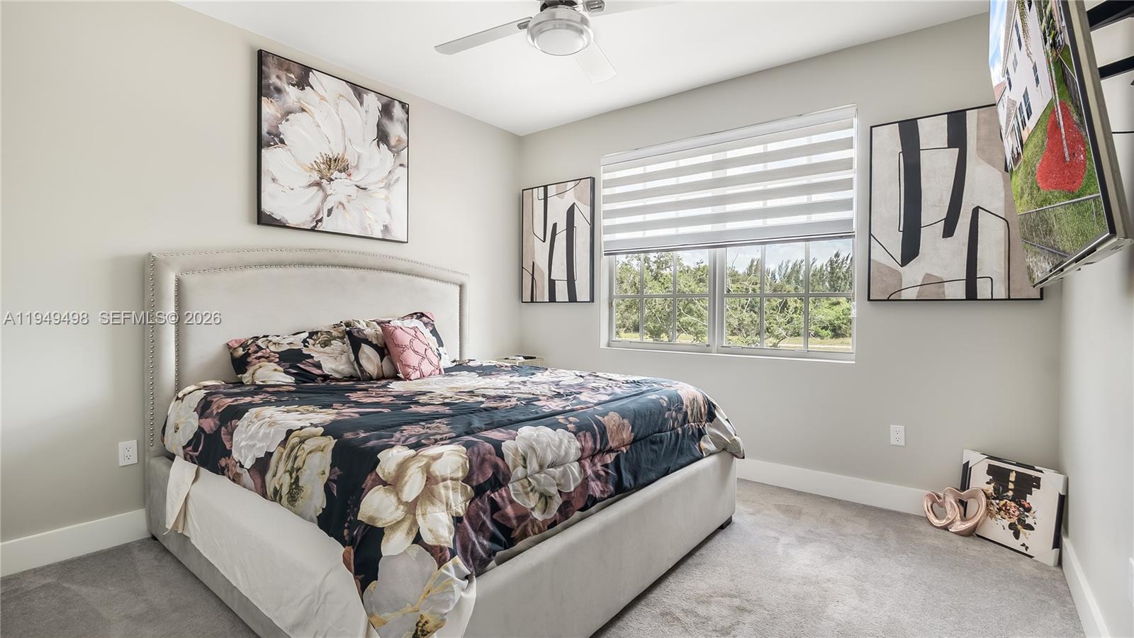 17739 Southwest 54th Street Miramar, FL 33029 - Photo 25 of 47 a bed sitting in a bedroom next to a window