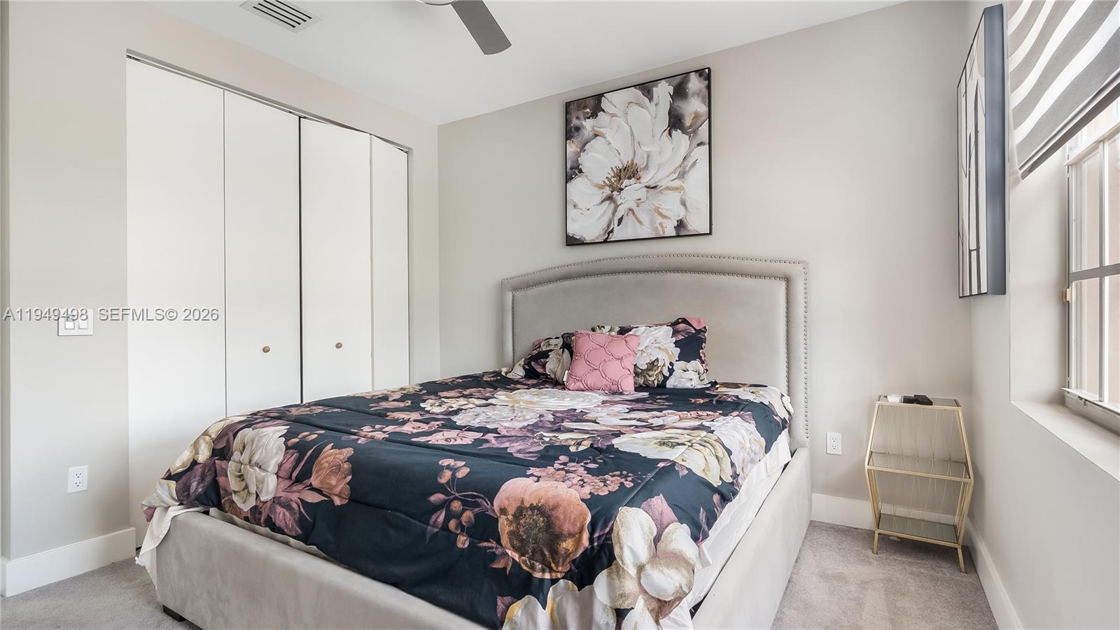 17739 Southwest 54th Street Miramar, FL 33029 - Photo 26 of 47 a bedroom with a bed and painting on the wall