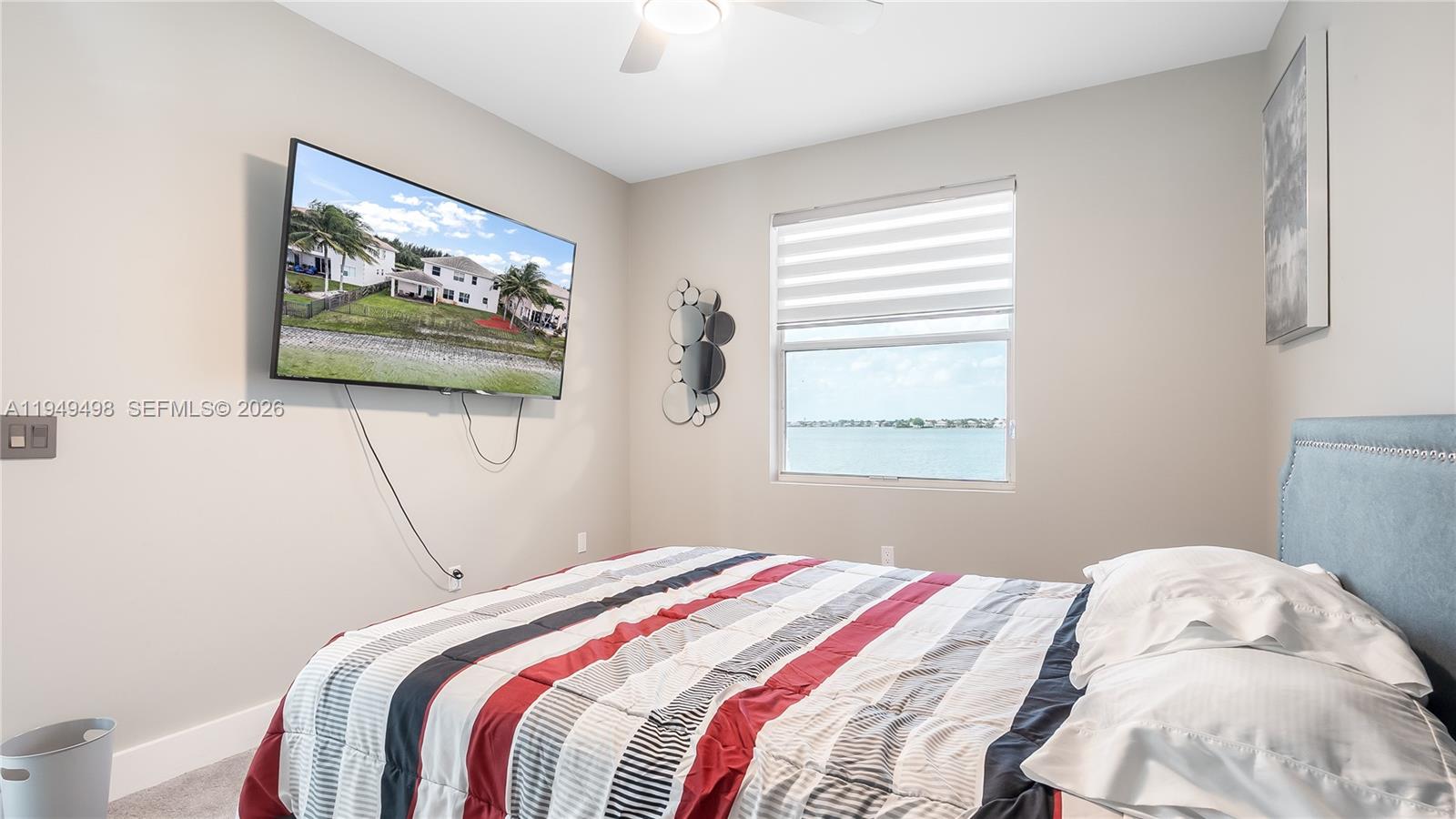 17739 Southwest 54th Street Miramar, FL 33029 - Photo 30 of 47 a bedroom with bed and wall painting