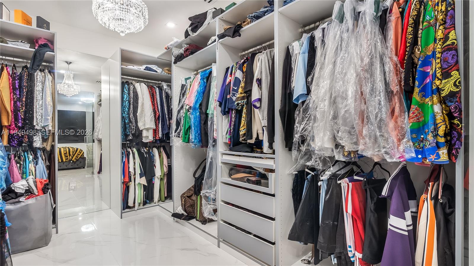 17739 Southwest 54th Street Miramar, FL 33029 - Photo 39 of 47 a view of walk in closet with clothes and shoes