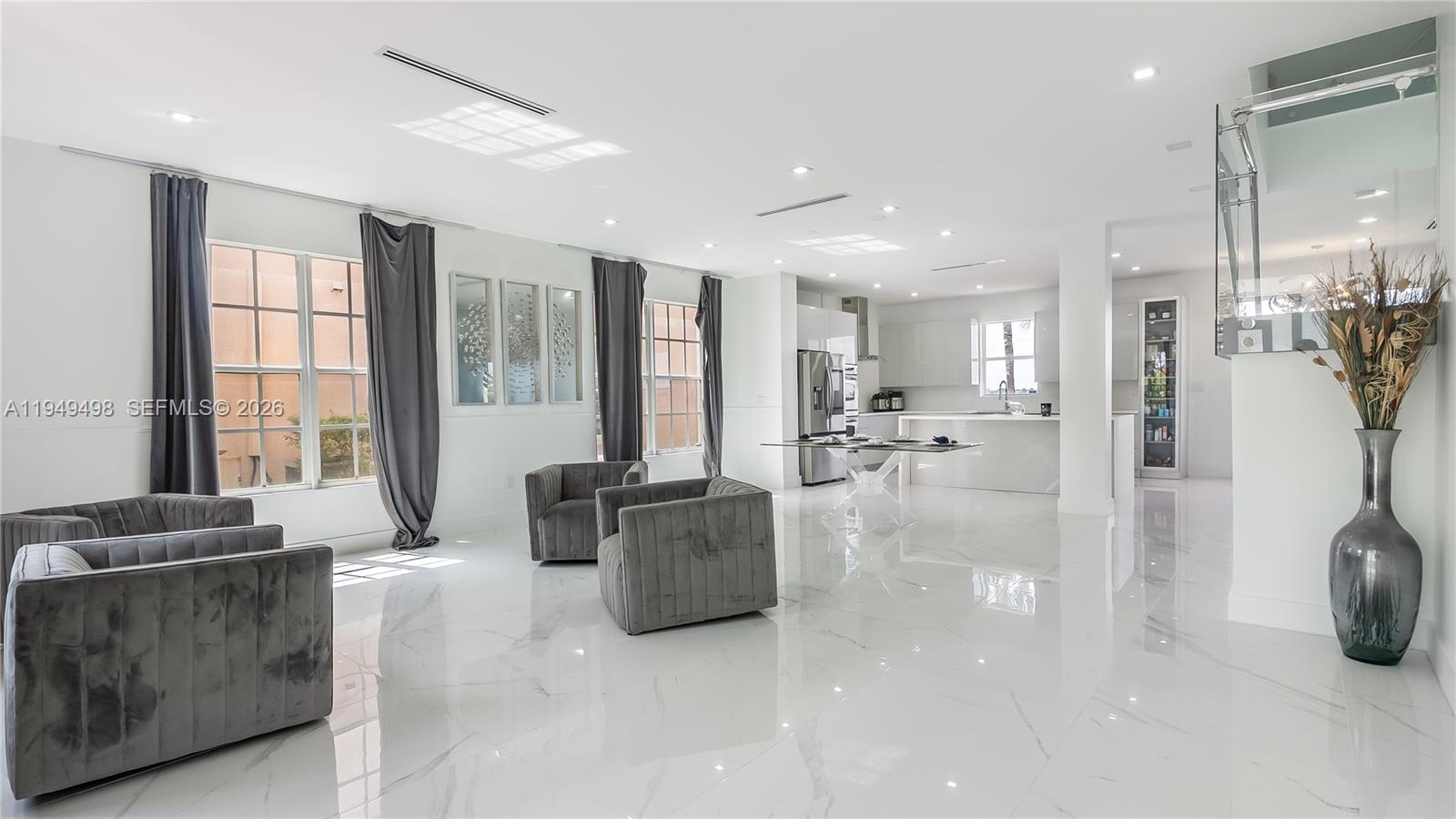 17739 Southwest 54th Street Miramar, FL 33029 - Photo 4 of 47 a living room with furniture and large windows