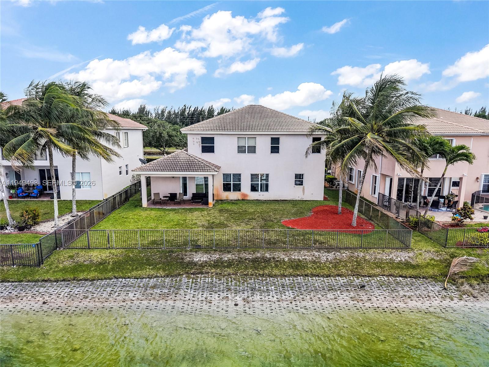 17739 Southwest 54th Street Miramar, FL 33029 - Photo 44 of 47 a front view of a house with a yard