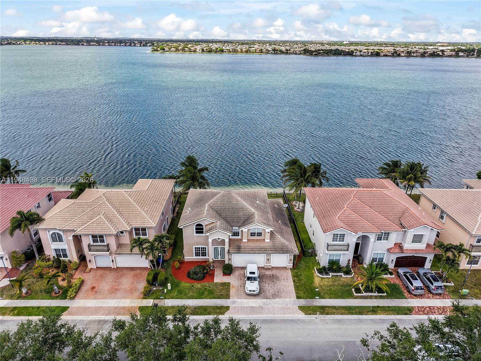 17739 Southwest 54th Street Miramar, FL 33029 - Photo 45 of 47 an aerial view of a house with a garden and lake view