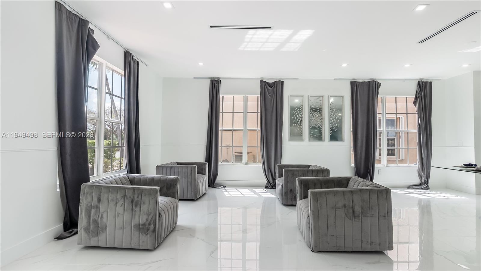 17739 Southwest 54th Street Miramar, FL 33029 - Photo 5 of 47 a living room with furniture and large windows