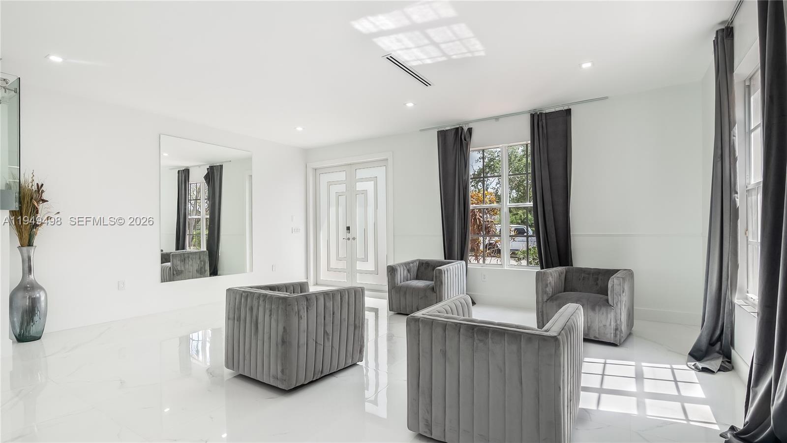 17739 Southwest 54th Street Miramar, FL 33029 - Photo 6 of 47 a living room with furniture and a window