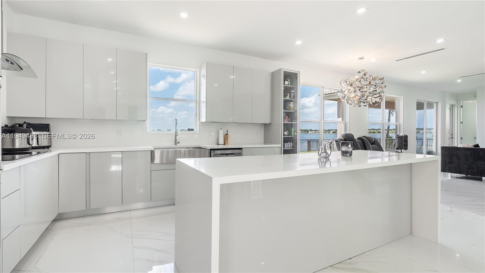 17739 Southwest 54th Street Miramar, FL 33029 - Photo 8 of 47 a kitchen with stainless steel appliances a sink stove and cabinets