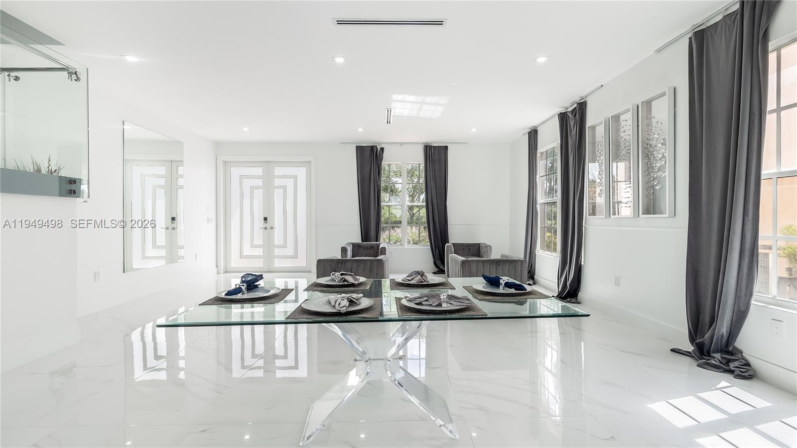 17739 Southwest 54th Street Miramar, FL 33029 - Photo 9 of 47 a room with lots of chairs and mirrors