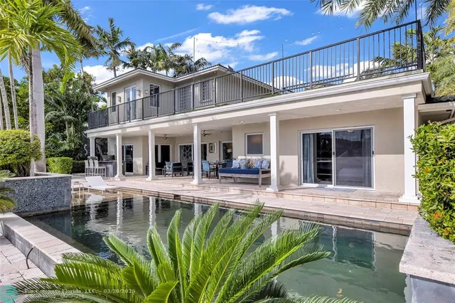 a house view with a seating space and a garden view