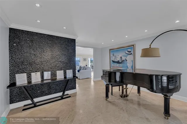 a kitchen with stainless steel appliances kitchen island granite countertop a table and chairs in it