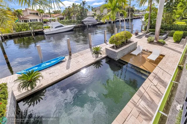 a view of a patio with swimming pool table and chairs