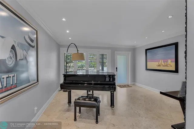 a kitchen with stainless steel appliances granite countertop a sink a stove and chairs