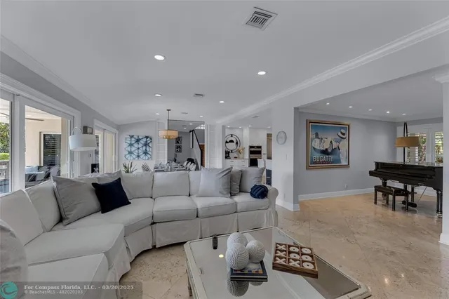 a view of a hallway with wooden floor and stairs