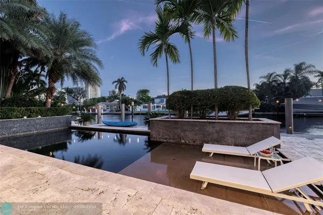 a spacious bedroom with a large bed and windows