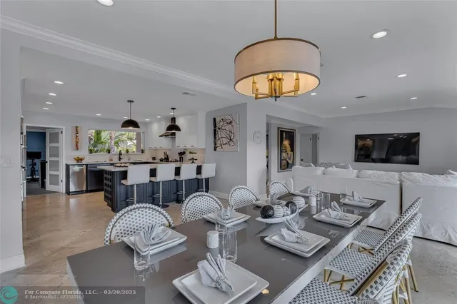 a view of a livingroom with wooden floor and staircase