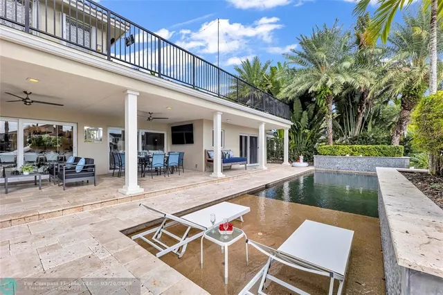 a bedroom with a bed wooden floor and window