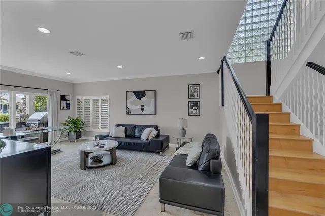 a view of a building with a yard and sitting area