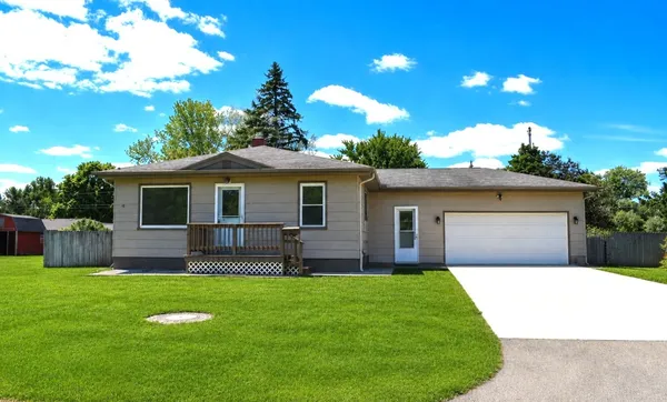 a view of a house with a yard and a garden