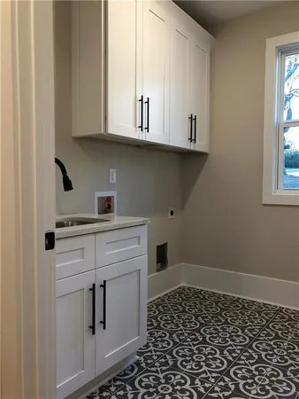 a kitchen with a sink and cabinets