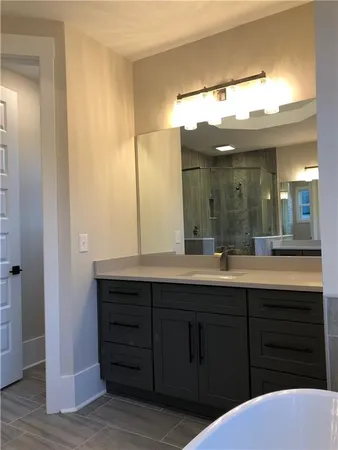 a bathroom with a sink and a mirror