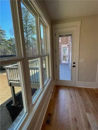 a view of front door with wooden floor