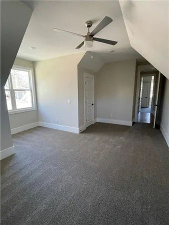 an empty room with windows and entrance