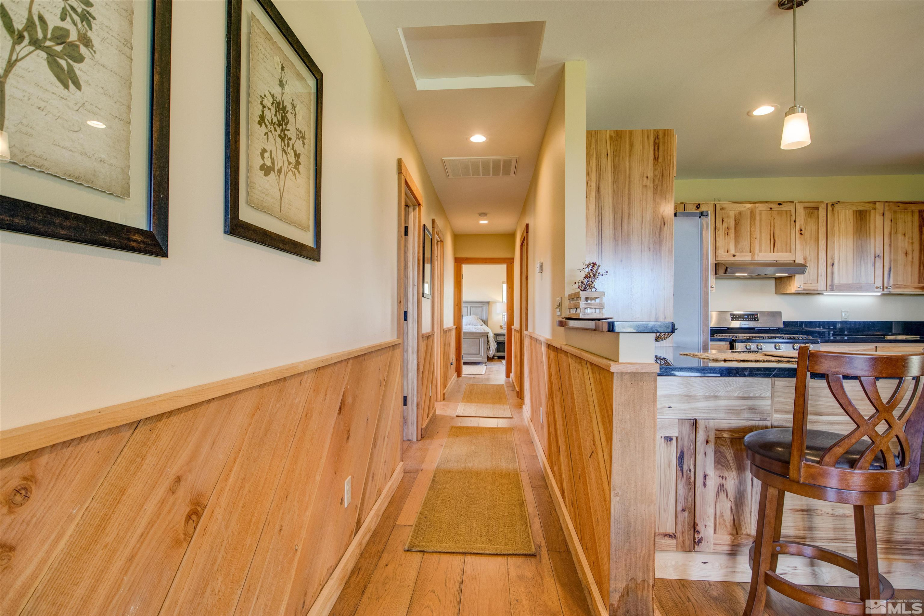 1461 Foothill Road Gardnerville, NV 89460 - Photo 14 of 39 a view of a kitchen with furniture and wooden floor