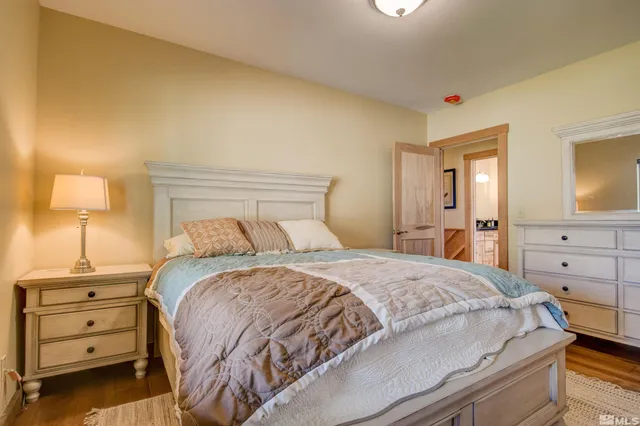 a bedroom with a bed and a night stand