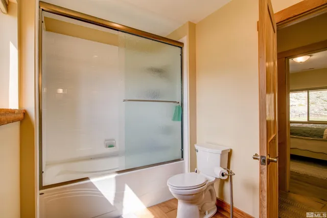 a bathroom with a shower and a toilet
