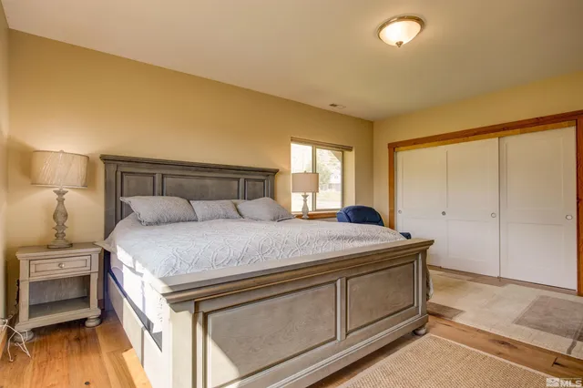 a bedroom with a bed and a dresser
