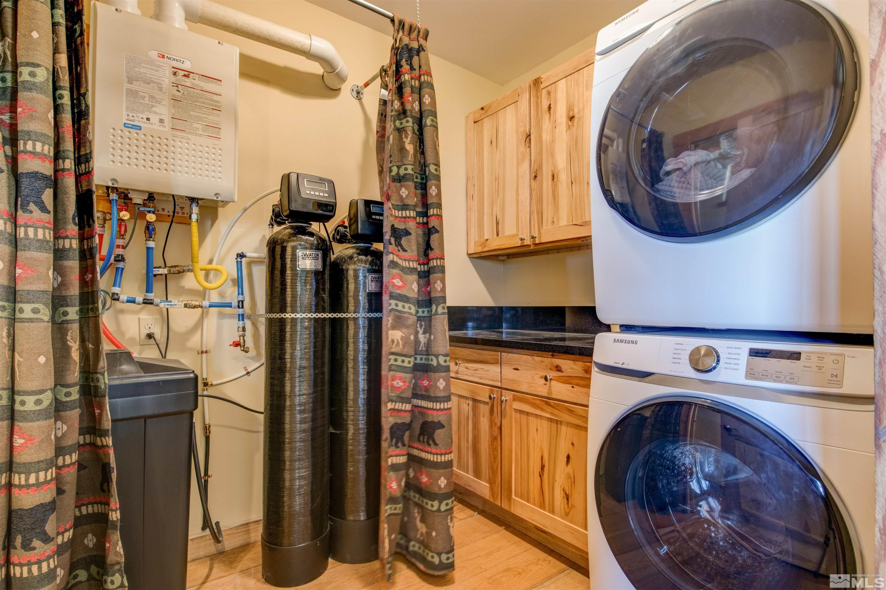 1461 Foothill Road Gardnerville, NV 89460 - Photo 23 of 39 a utility room with dryer and washer