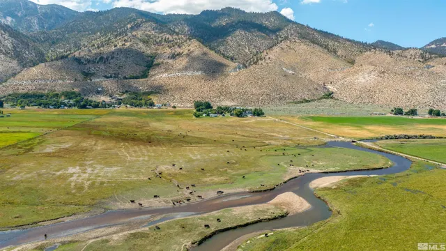 a view of an ocean from a mountain