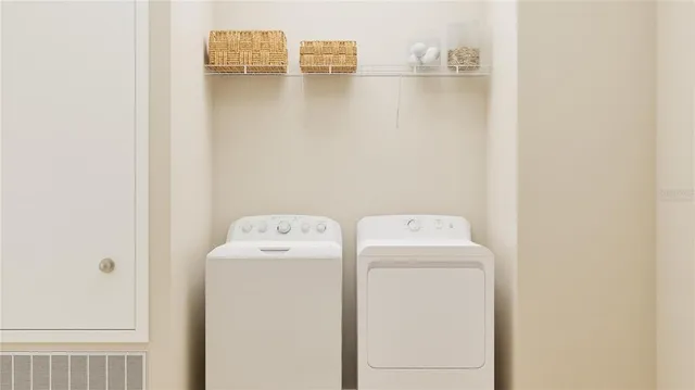 a utility room with dryer and washer