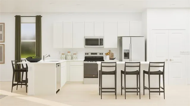 a kitchen with a table chairs and a refrigerator