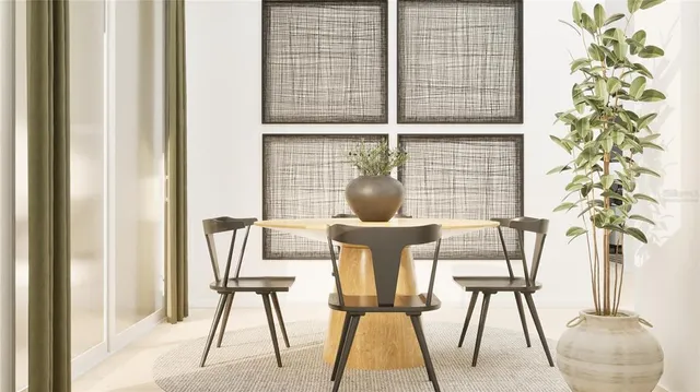 a living room filled with furniture and a potted plant