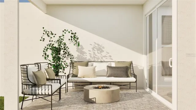 a white and sitting area with a rug