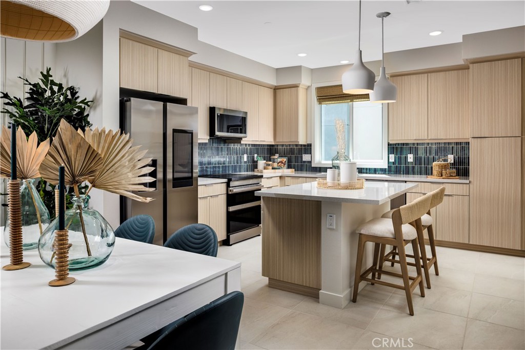 838 Lexi Lane Covina, CA 91722 - Photo 4 of 12 a kitchen with sink a refrigerator and chairs