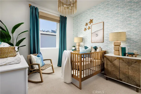 a bedroom with furniture and a window