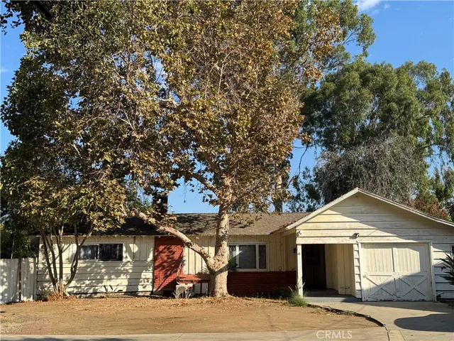 a front view of a house with a garage