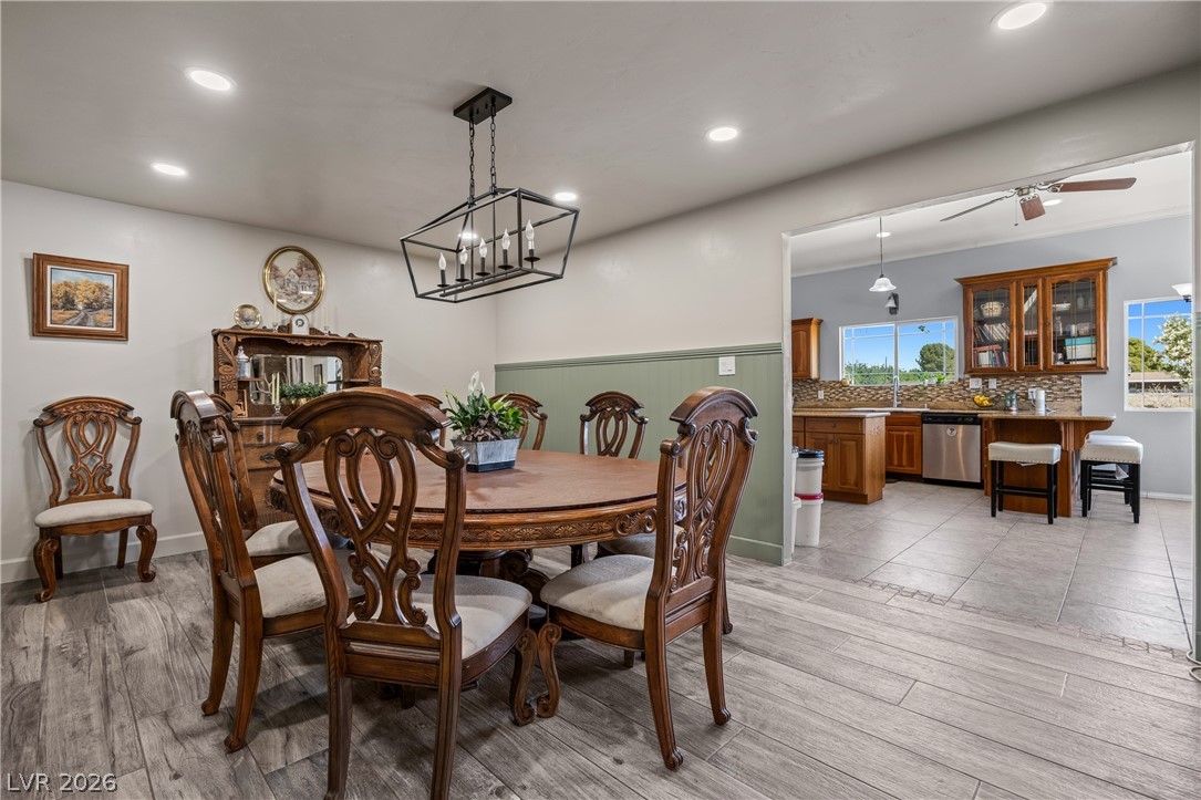 750 Leming Avenue Overton, NV 89040 - Photo 25 of 82 This inviting dining area features elegant wood flooring, seamlessly connecting to a well-appointed kitchen.