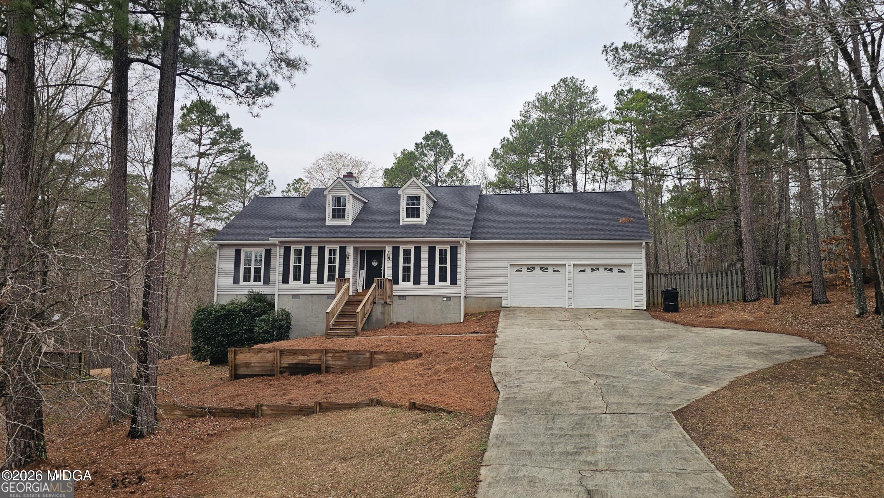 306 Lakeridge Court Macon, GA 31211 - Photo 1 of 14 a front view of a house with a yard