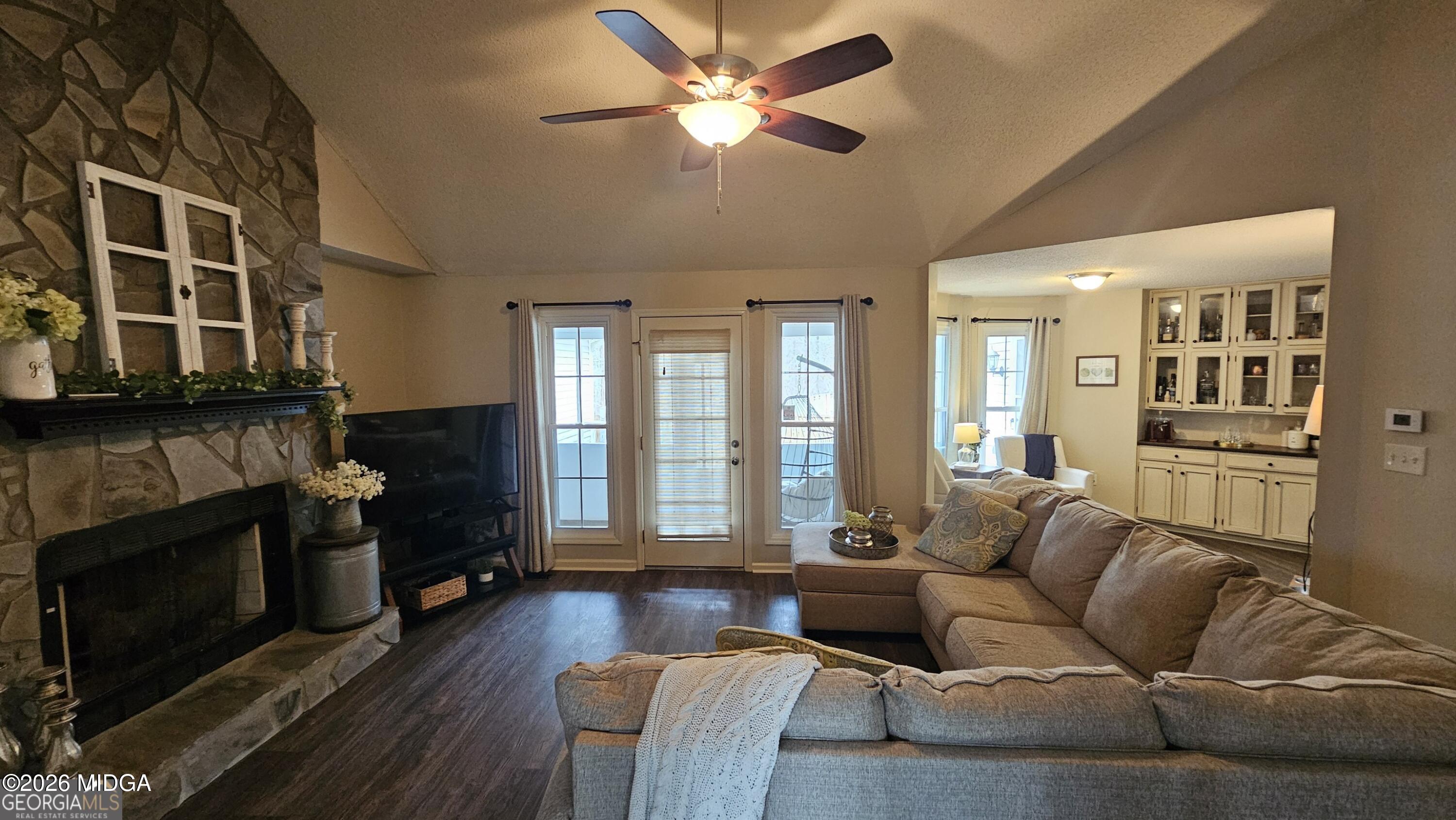 306 Lakeridge Court Macon, GA 31211 - Photo 2 of 14 a living room with furniture and a fireplace