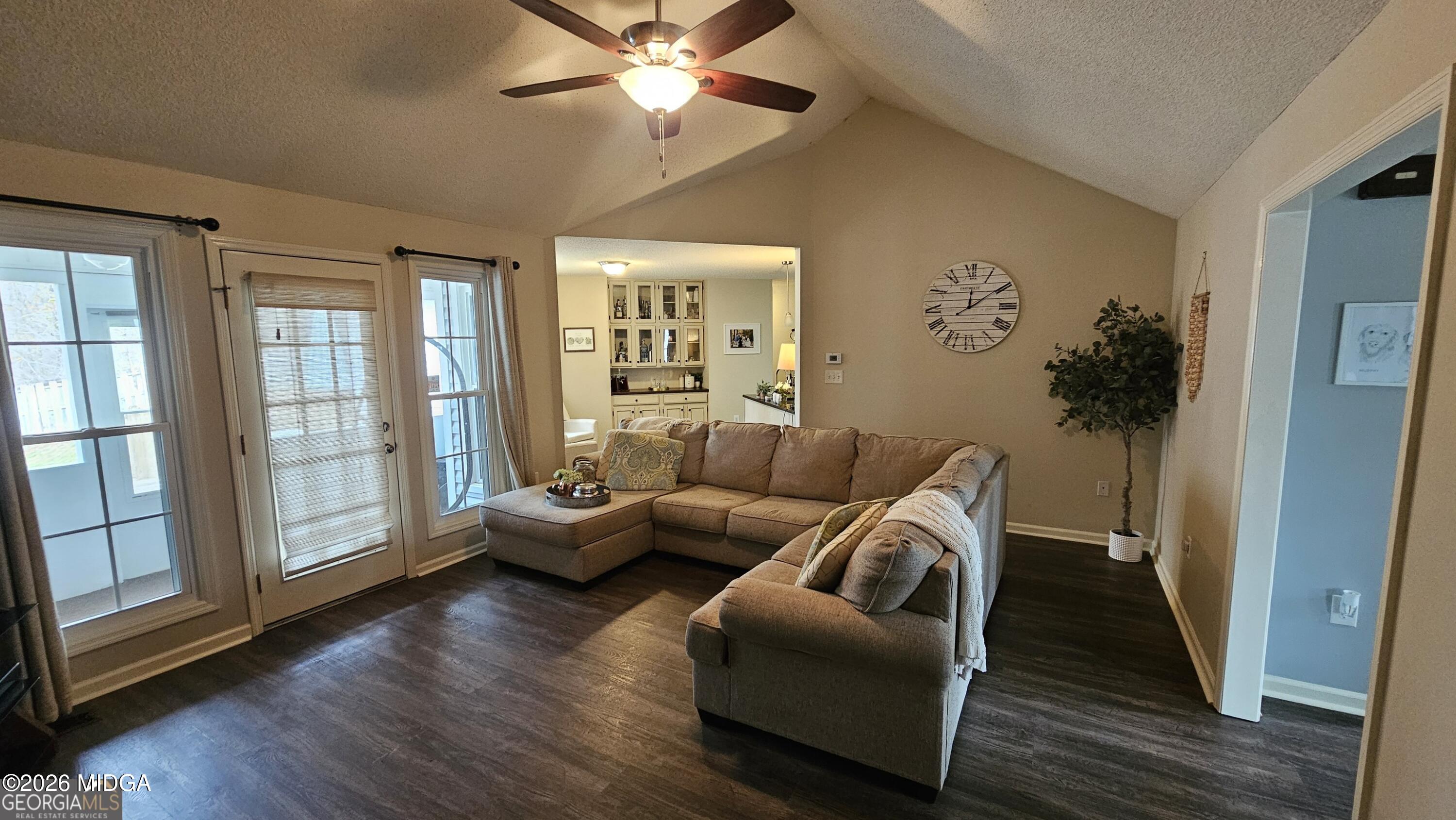 306 Lakeridge Court Macon, GA 31211 - Photo 4 of 14 a living room with furniture and wooden floor
